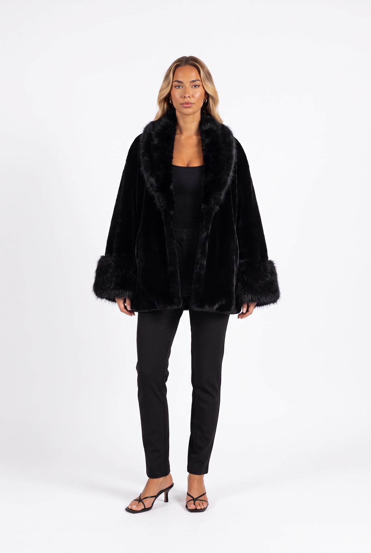 Black oversized faux mink coat with fluffy fur collar and cuffs — front